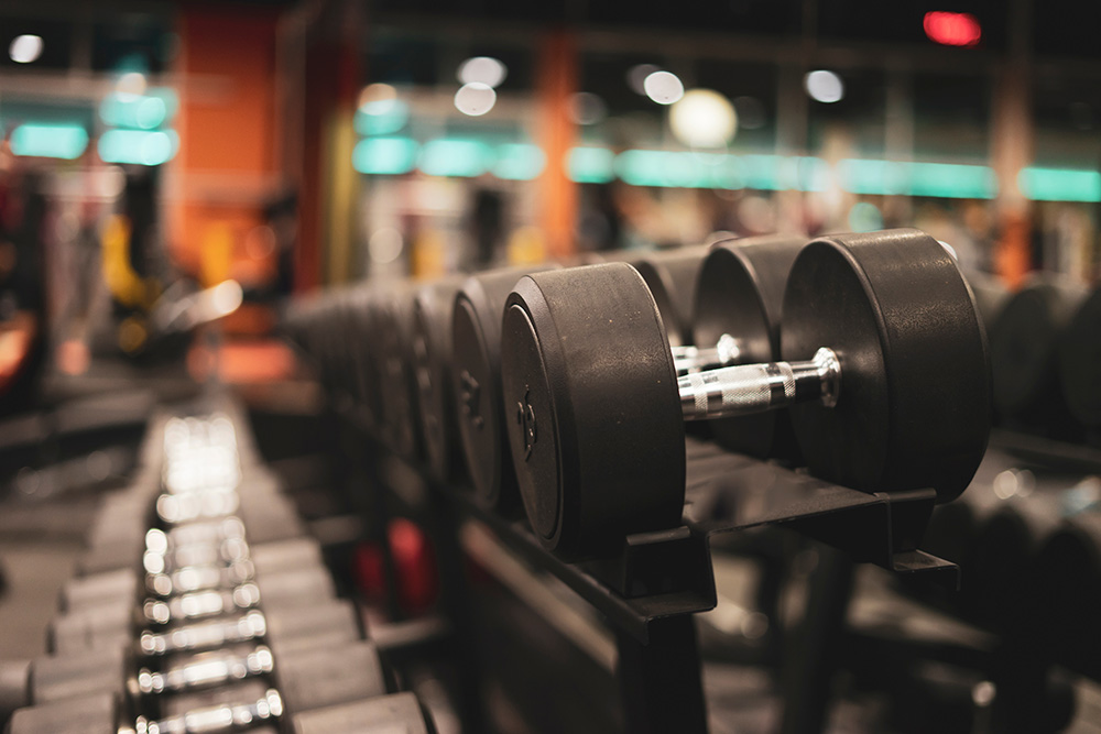 Young athletes doing strength training with modern equipment, high energy sports photography